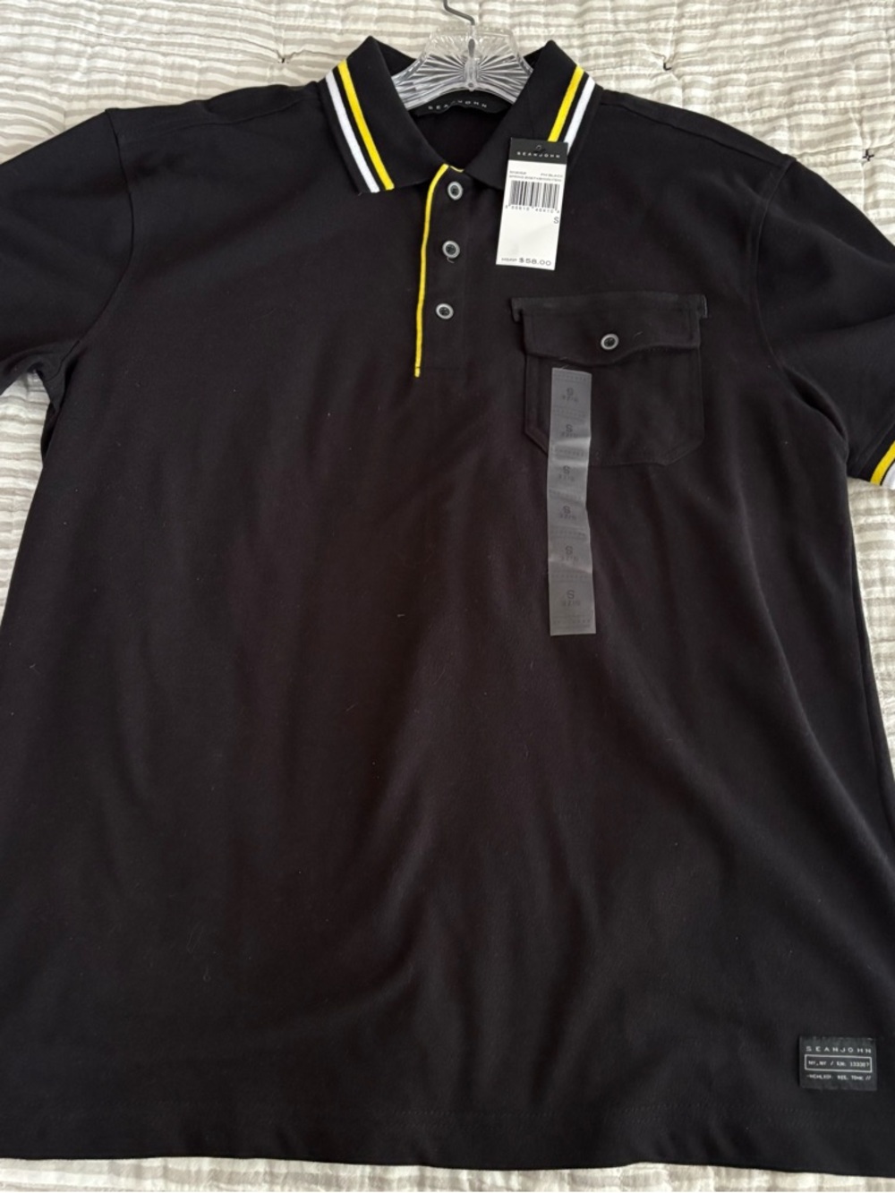 black polo shirt with yellow accents